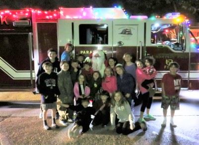 Kids Posing for Photo in Front of Fire Truck