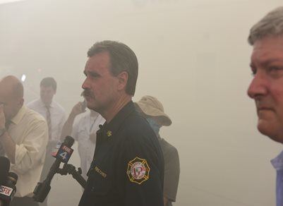 Fire Chief and Others at Site of Fire